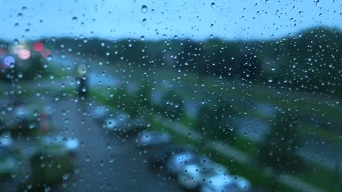 Raindrops on Window Pane Glass with Blurry Traffic Bokeh Timelapse Stock Footage 345370361