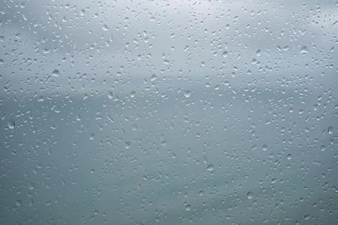 Raindrops on window panes, background with space to write Stock Photos