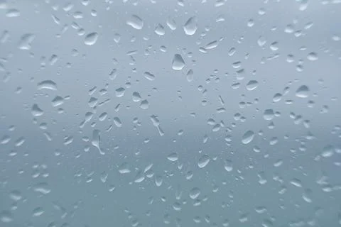 Raindrops on window panes, background with space to write Stock Photos