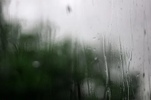 Raindrops on window , rainy day. Background raindrops. blurred background Stock Photos