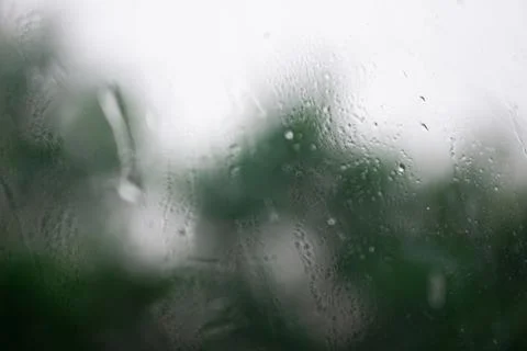 Raindrops on window , rainy day. Background raindrops. blurred background Stock Photos