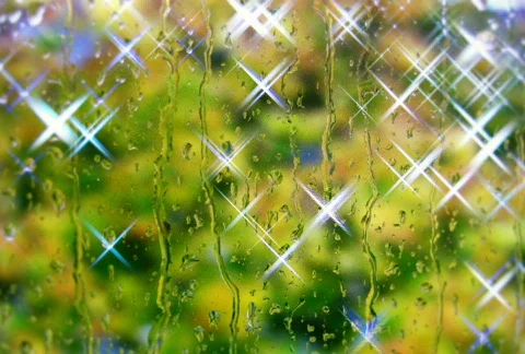 Raindrops on the window with shining effect NTSC HD PAL Stock Footage 299808