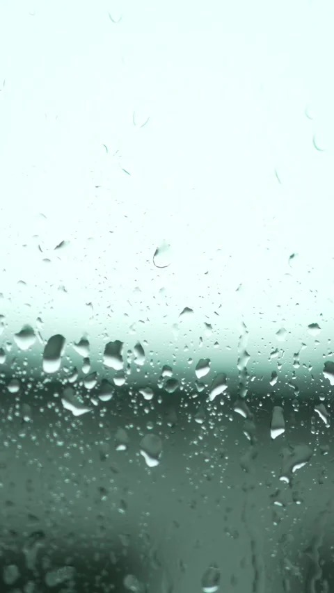 Raindrops on Window in Slow Motion Stock Footage 308389558