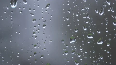 Raindrops on window useful for video backdrop or background Stock Footage 221478100