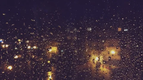 Raindrops on windows at night 4K Stock Footage 125342819
