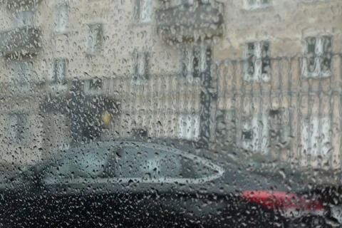 Raindrops on the windscreen of a car Stock Photos