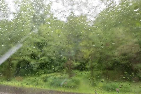 Raindrops on the windscreen of a car Stock Photos