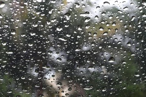 Raindrops in the windscreen of the car Stock Photos