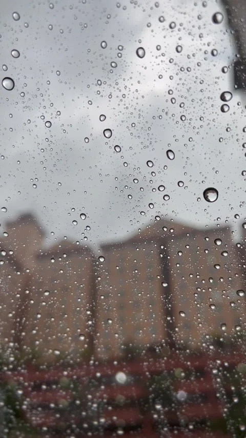 Raindrops on windscreen on rainy day Stock Footage 172387988