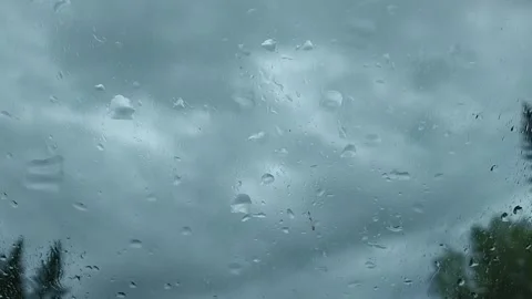 Raindrops on the windshield of the car against the background of the sky Stock Footage 160054689