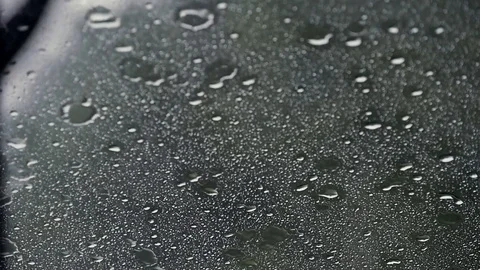 Raindrops on the windshield of a car Stock-Footage 80153790
