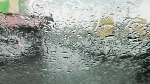 Raindrops on the Windshield of a car with parking area background footage. Stock Footage 295423899