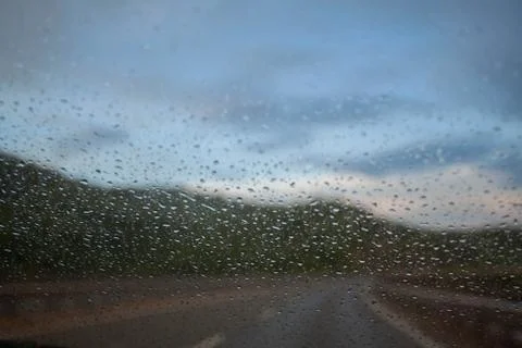 Raindrops on windshield of car Stock Photos
