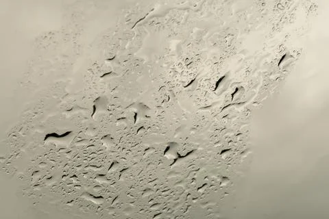 Raindrops on the windshield of the car. Photos