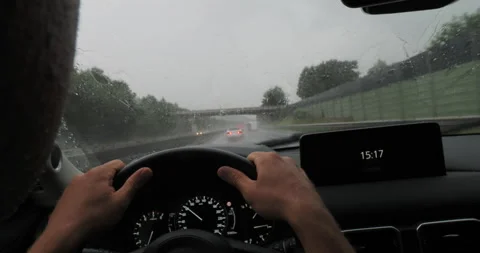 Raindrops on windshield during car drive Stock Footage 265240027