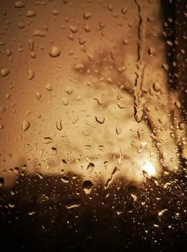 Raindrops on the windshield of a vehicle, captured from within Stock Photos