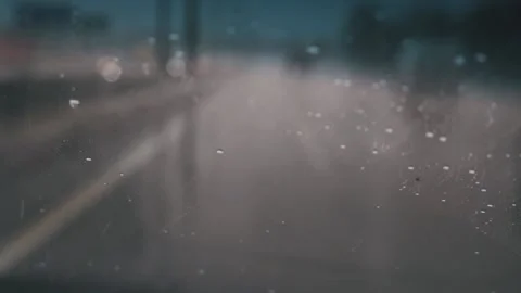 Raindrops on the windshield view from a driving car Stockbeeldmateriaal 152979355