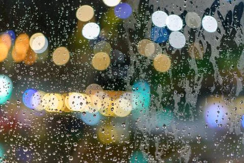Rained down on the window. While there is light passing through the window as Stock Photos