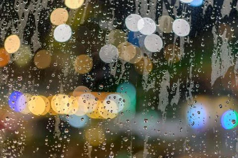 Rained down on the window. While there is light passing through the window as Stock Photos