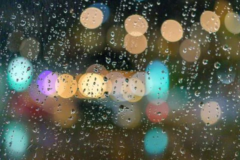 Rained down on the window. While there is light passing through the window as Stock Photos