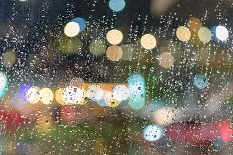 Rained down on the window. While there is light passing through the window as Stock Photos