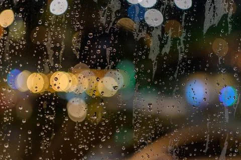 Rained down on the window. While there is light passing through the window as Stock Photos