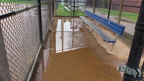 Rained out local baseball dugout, puddle, stock footage Stock Footage 297567003