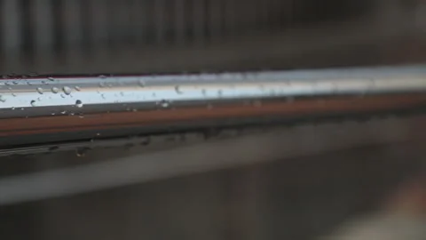 Rainedrops on a mtal handrail, close-up Stock Footage 134913218