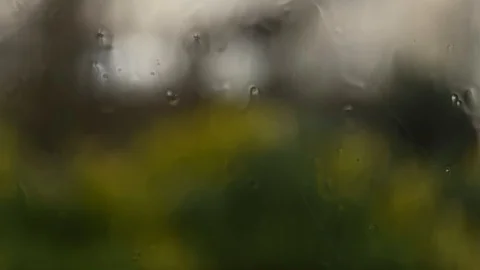 Rainfall against a house window during a storm close up Vídeo Stock 124798246