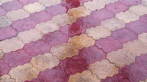 Rainfall and Raindrops on Colorful Wet Pavement After Rain Stock Footage 342574774