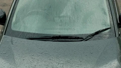 Rainfall on Car Windscreen and Hood Stock Footage 337154025