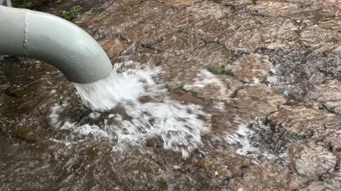 Rainfall. Gutter. Drainage pipe for removing rainwater from the roof. Rainwater Stock Footage 316977253