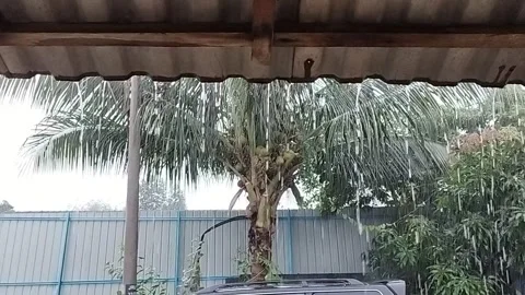 Rainfall from the roof of the house Stock Footage 305044077