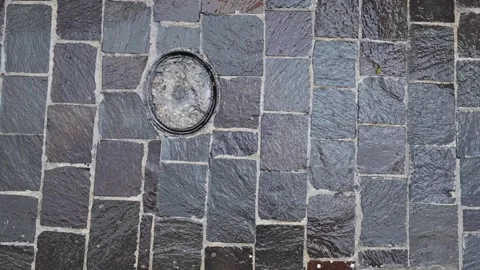 Rainfall on Stone Pavement During a Thunderstorm Stock Footage 324810154