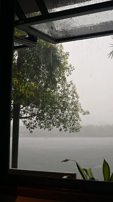Rainfall Through Window with Scenic View Stock Footage 337697024