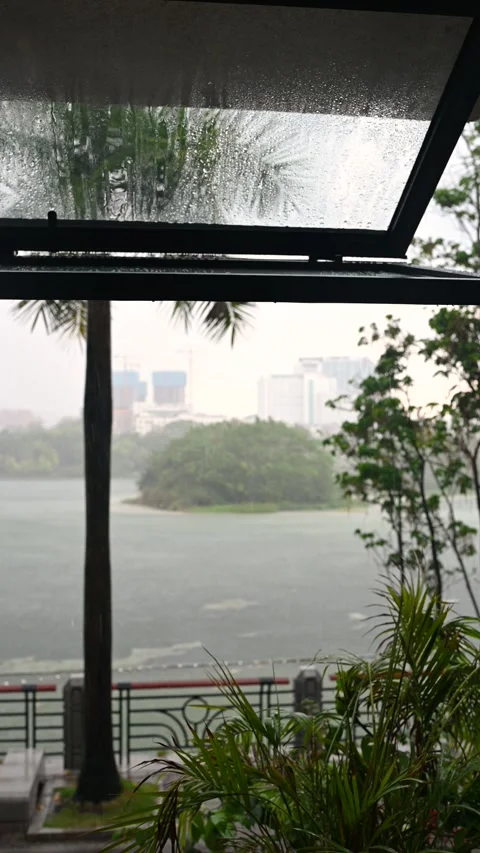 Rainfall on Window with Scenic View of Lake Stock Footage 337697020