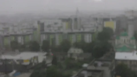 Raining against building blurred Stock Footage 120611536