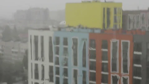 Raining against building blurred Stock Footage 120611583