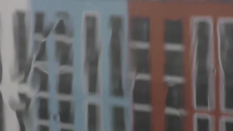 Raining against building blurred Stock Footage 120611689