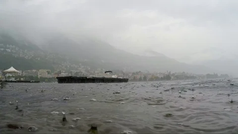 Raining on Alpine Lake with Mountain Stock-Footage 111697843