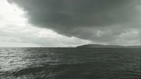 Raining and Dark cloud sky stormy over island and sea Stock Footage 153506657