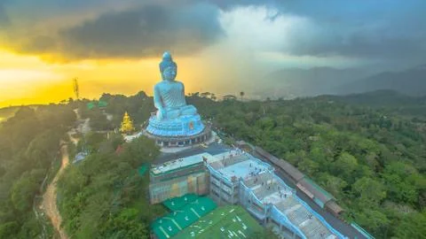 Raining at big Phuket's Buddha in sunset Stock Photos