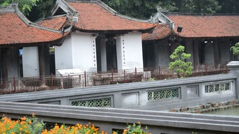Raining on buildings inside a Vietnamese buddhist temple Stock Footage 100319744