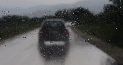 Raining in a Car on the Road Stock Footage 122450677