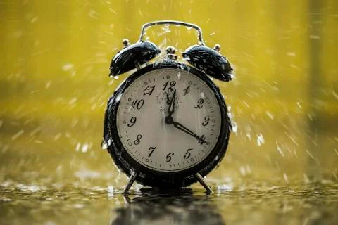 Raining on the clock Stock Photos