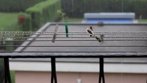 Raining on clothes hook wires Stock Footage 145710850