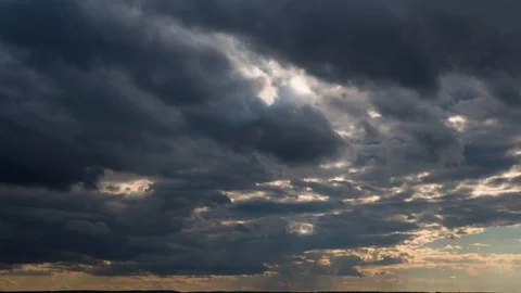 Raining cloudy Sunset time lapse motion, fast moving rain clouds after bad Stock Footage 105157492