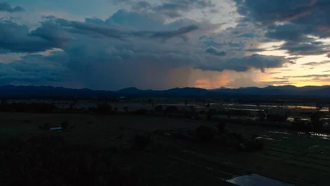 Raining from dark storm cloud with sunset Video stock 93237999