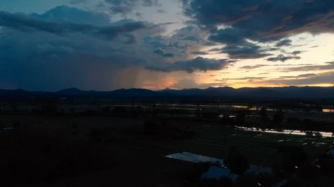 Raining from dark storm cloud with sunset Video stock 93238021