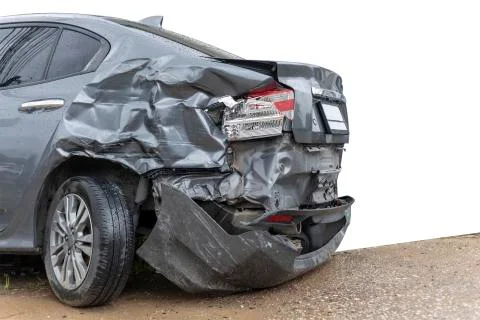 In raining day back side of  gray color car damaged and broken by accident on Stock Photos